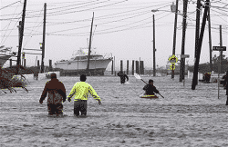 People wading in water from Storm Sandy